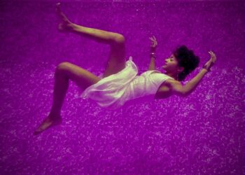 woman falls on purple surface